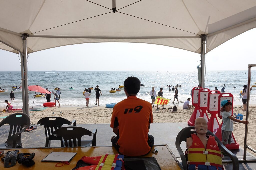Boryeong Mud Festival main venue Daecheon Beach with lifeguard on the white sand shore