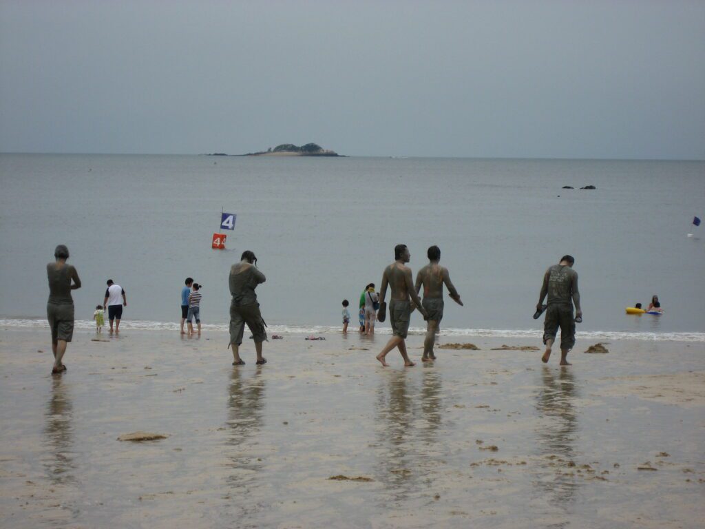 Boryeong Mud Festival foreigner guide visitors enjoying the mud pool inside the experience zone