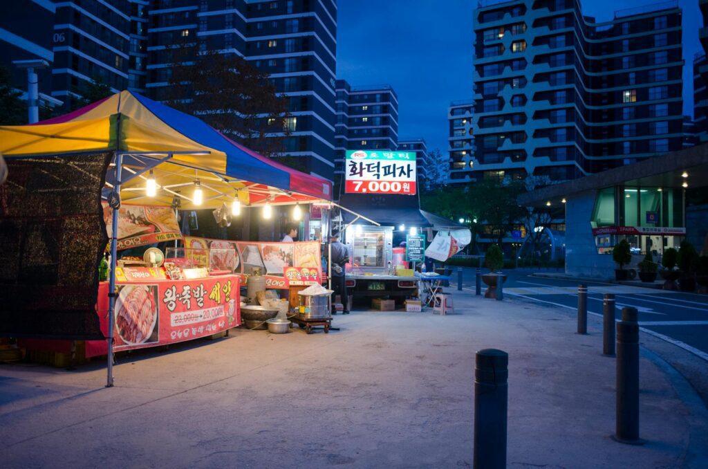 University campus food guide regulars — Korean night market street-food stalls at a pojangmacha
