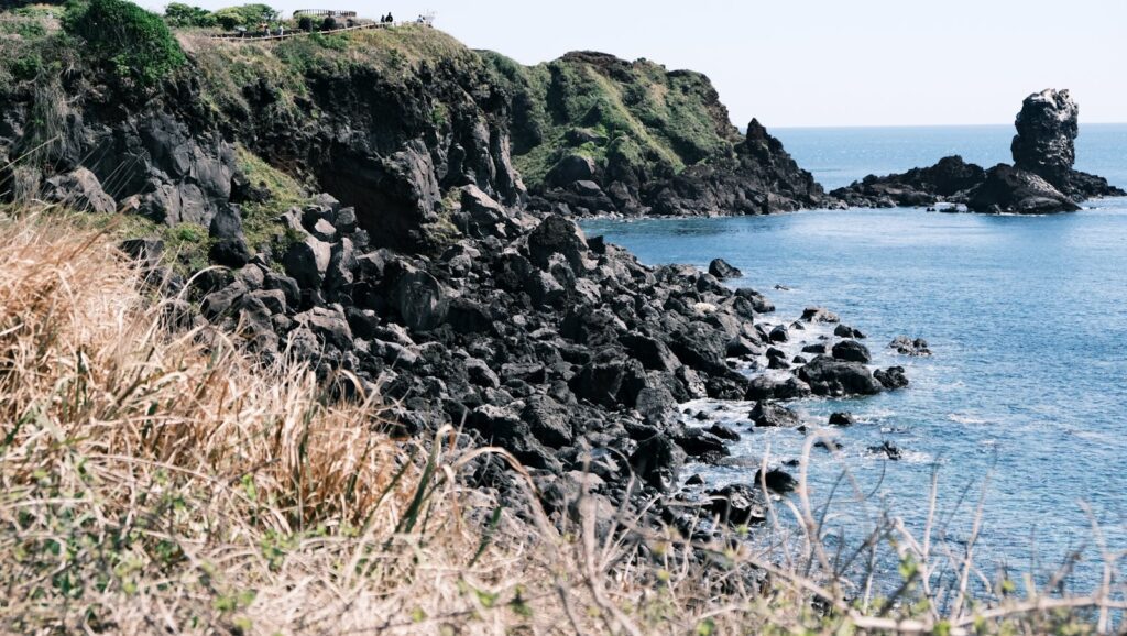 Seongsan Ilchulbong Seopjikoji guide coastal cliff view