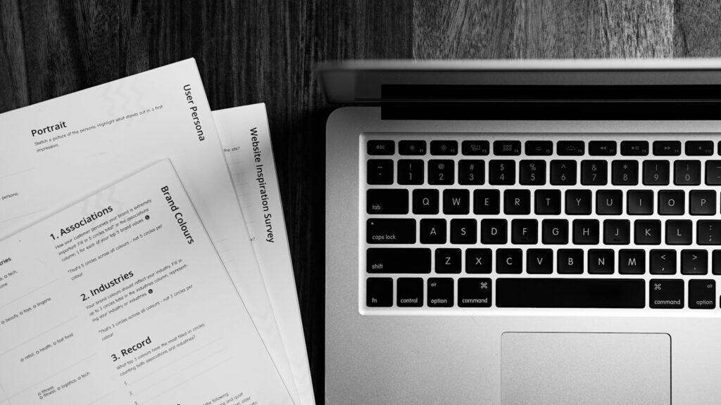 Study abroad experience for career use CV writing on laptop at desk