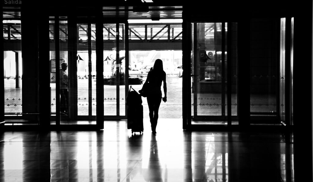exchange student preparation timeline — airport departure with luggage
