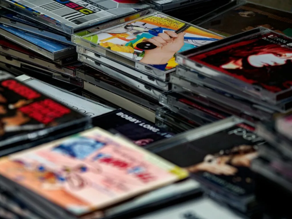 K-pop merchandise shopping with albums and photocards on display